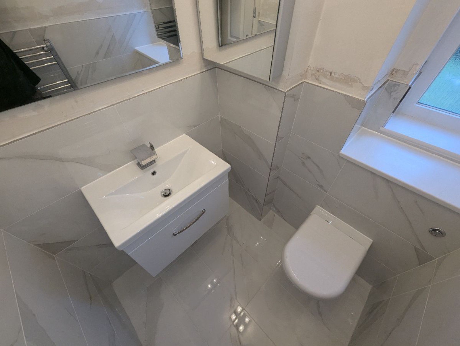 Finished bathroom with wall-hung basin and WC