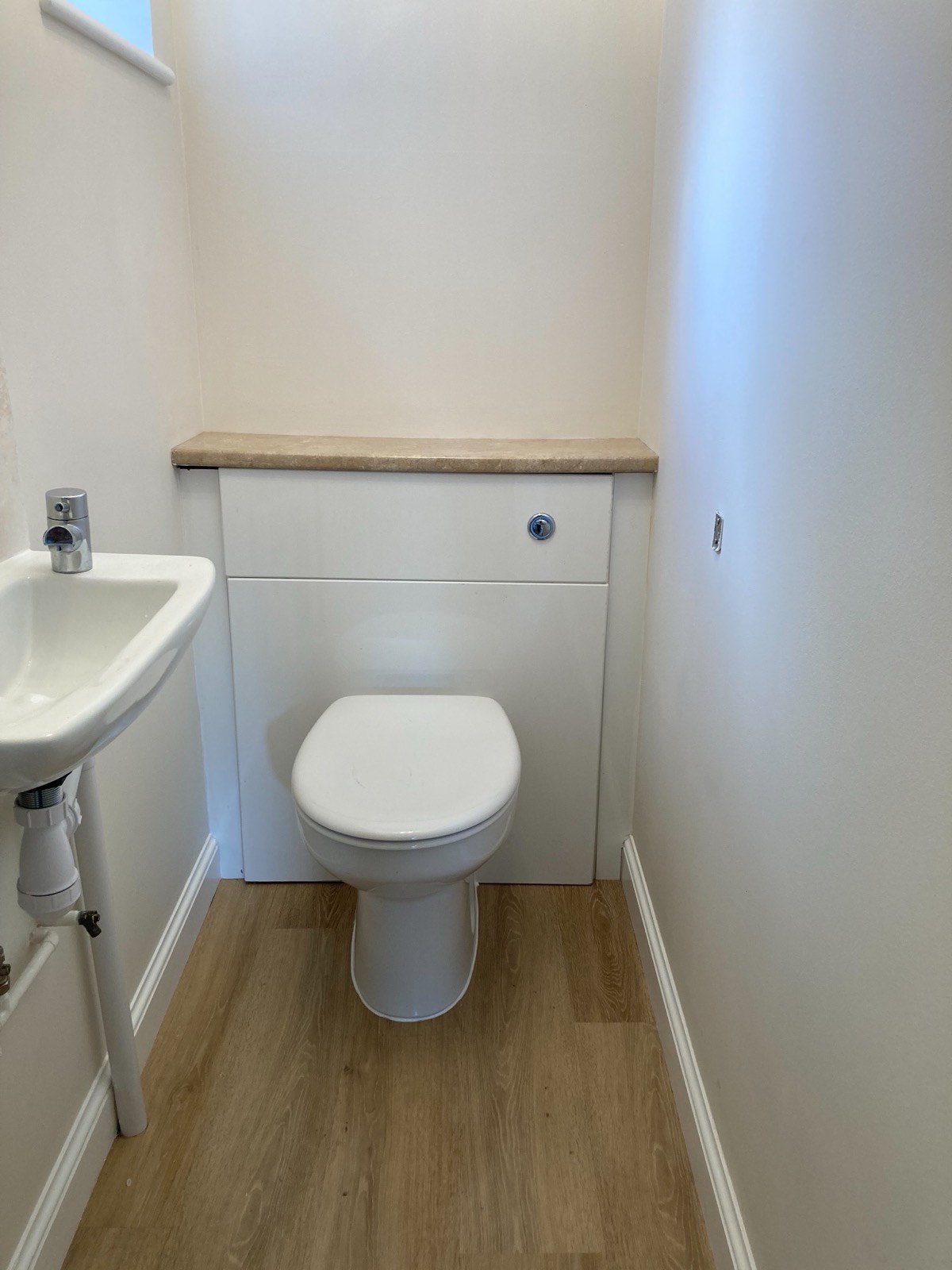 Completed cloakroom with basin and toilet