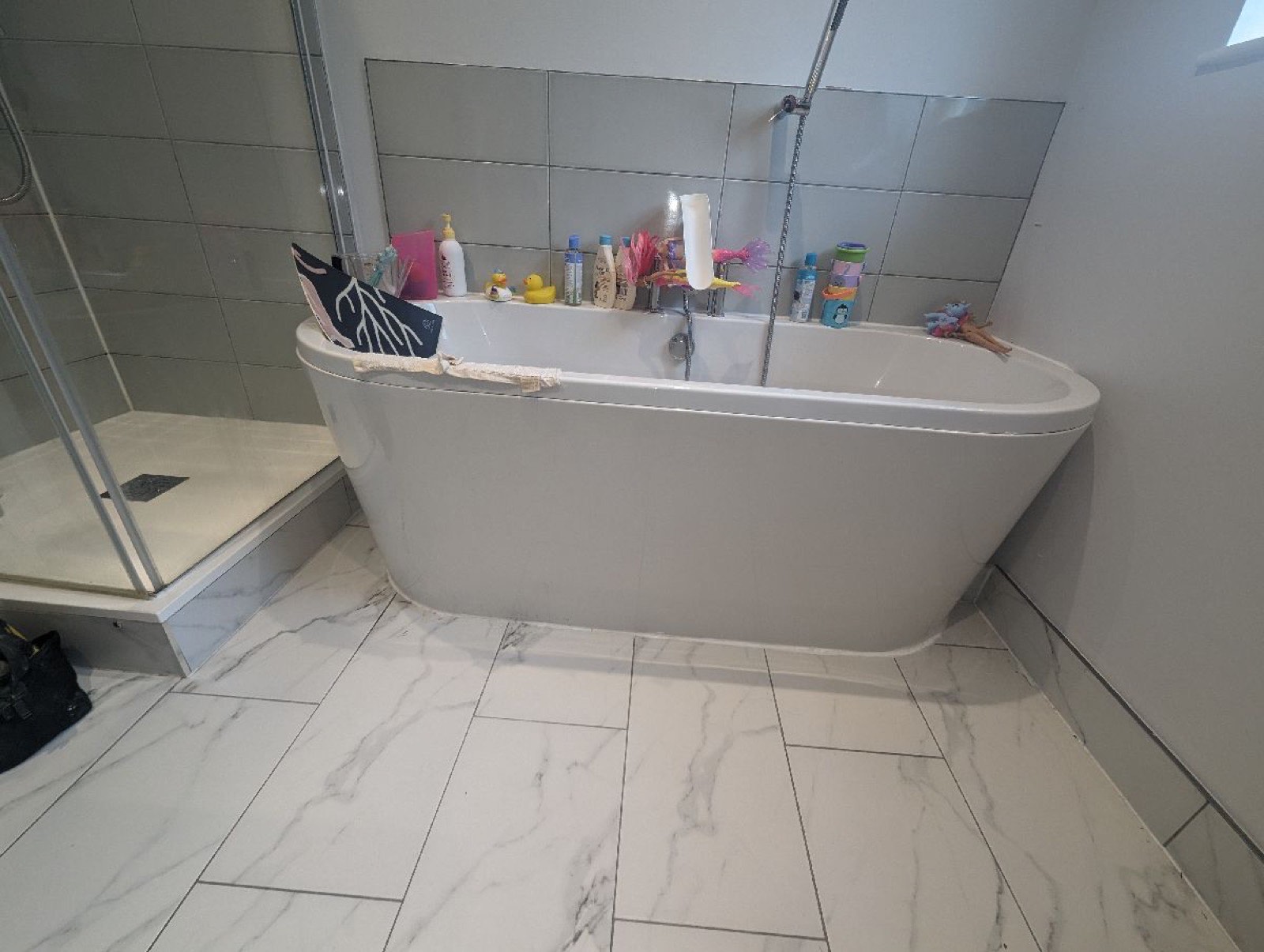 Freestanding bath installed in a finished bathroom