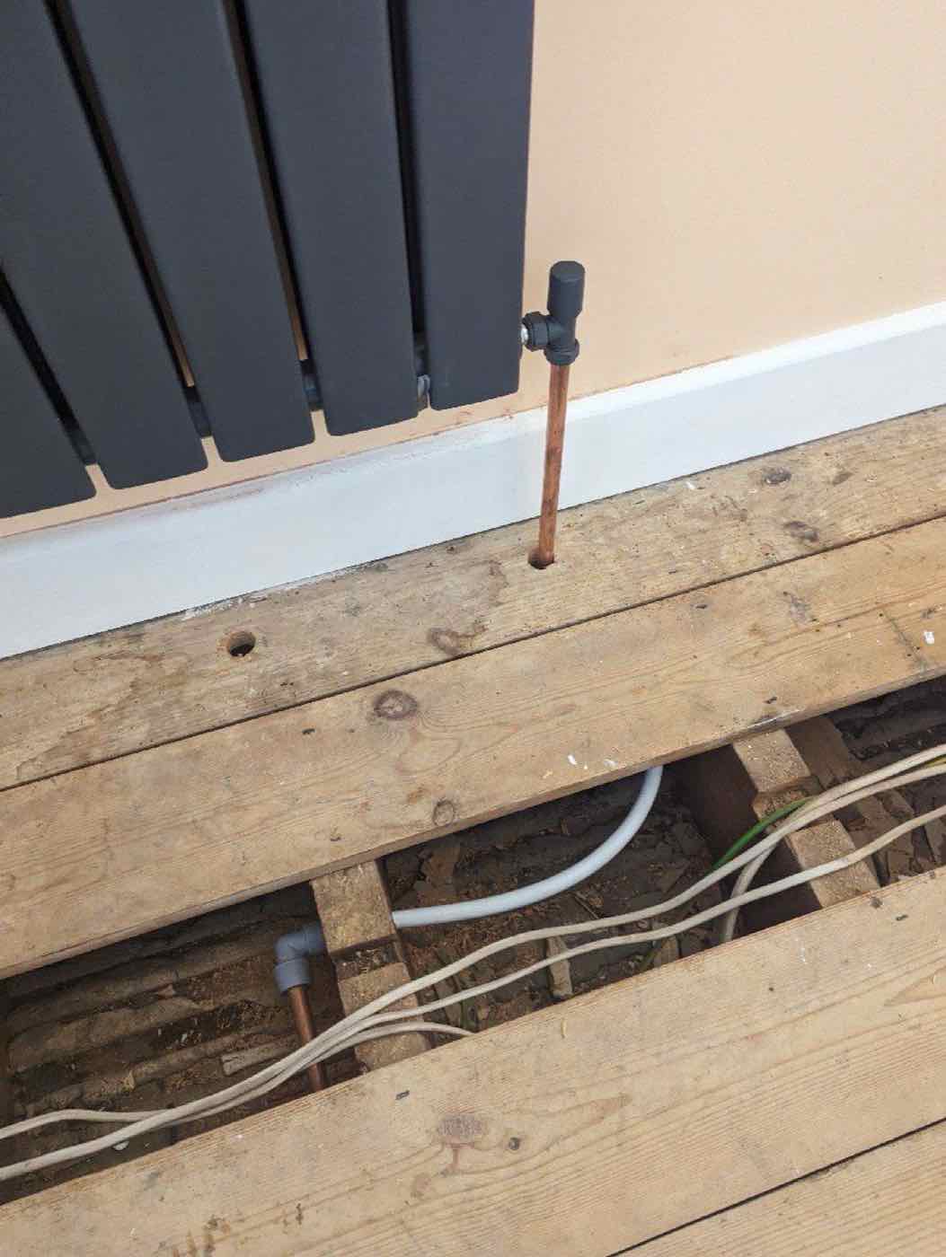 Vertical designer radiator with new copper pipework