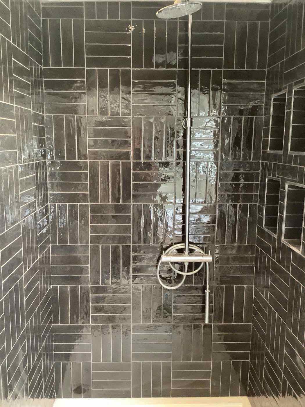 Tiled shower enclosure with rainfall head fitted by Plumbing Angels